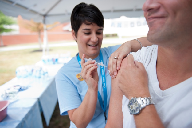Melissa Davis gives the flu vaccine