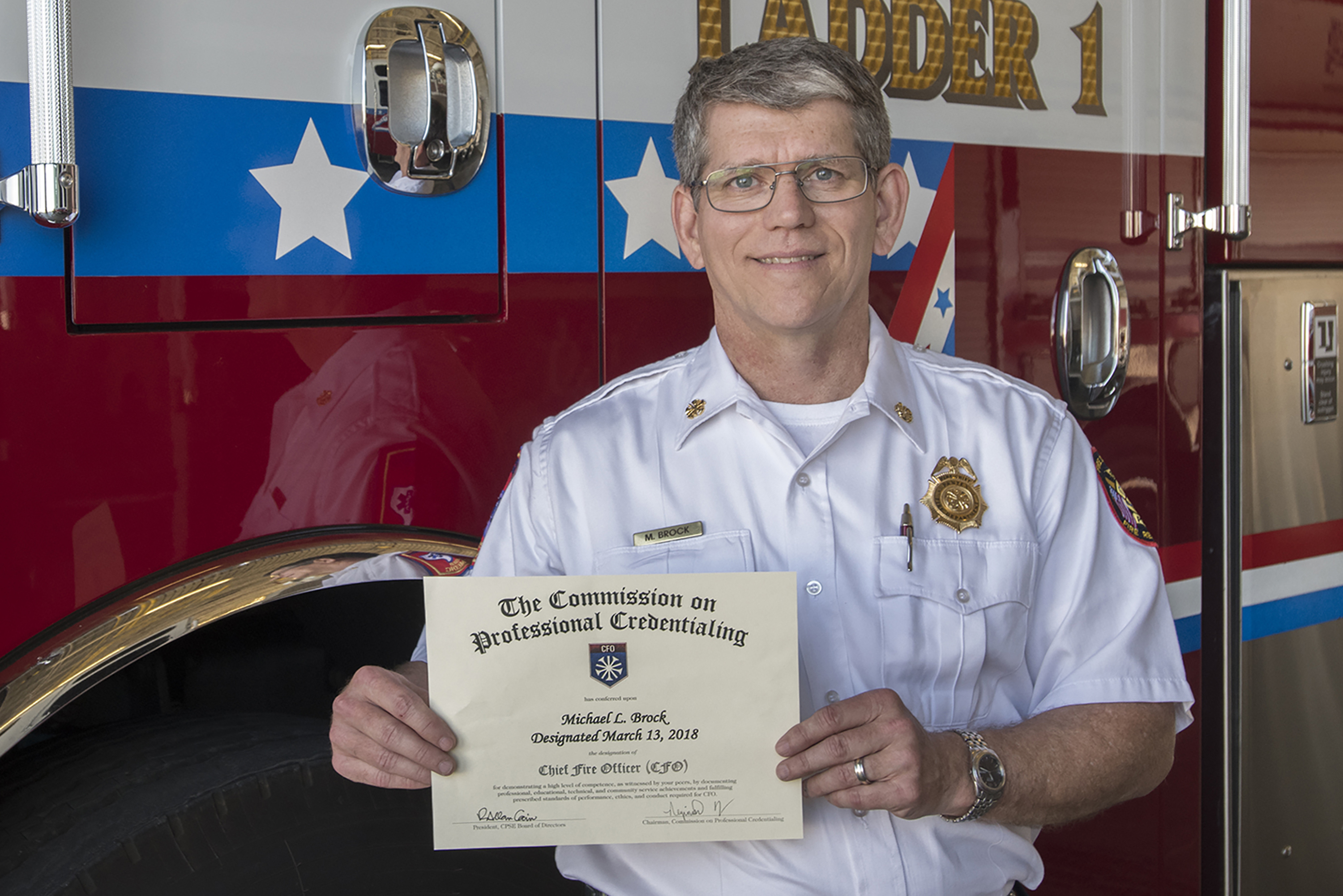 Chief Mike Brock displays his Chief Fire Officer Credentials 